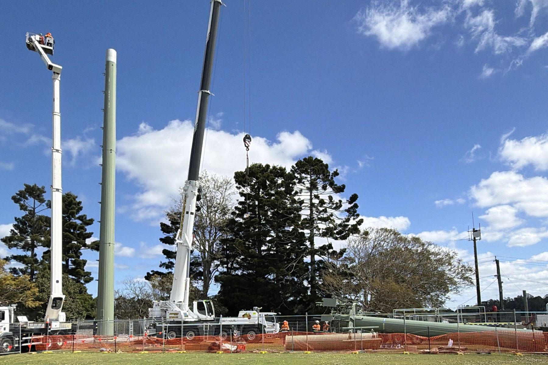 Crane, EWP and crew standing a monopole, Beechmont QLD